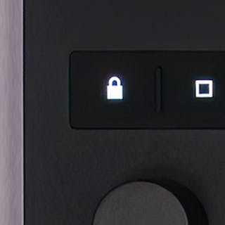 Detail photo of Push’s lock button.